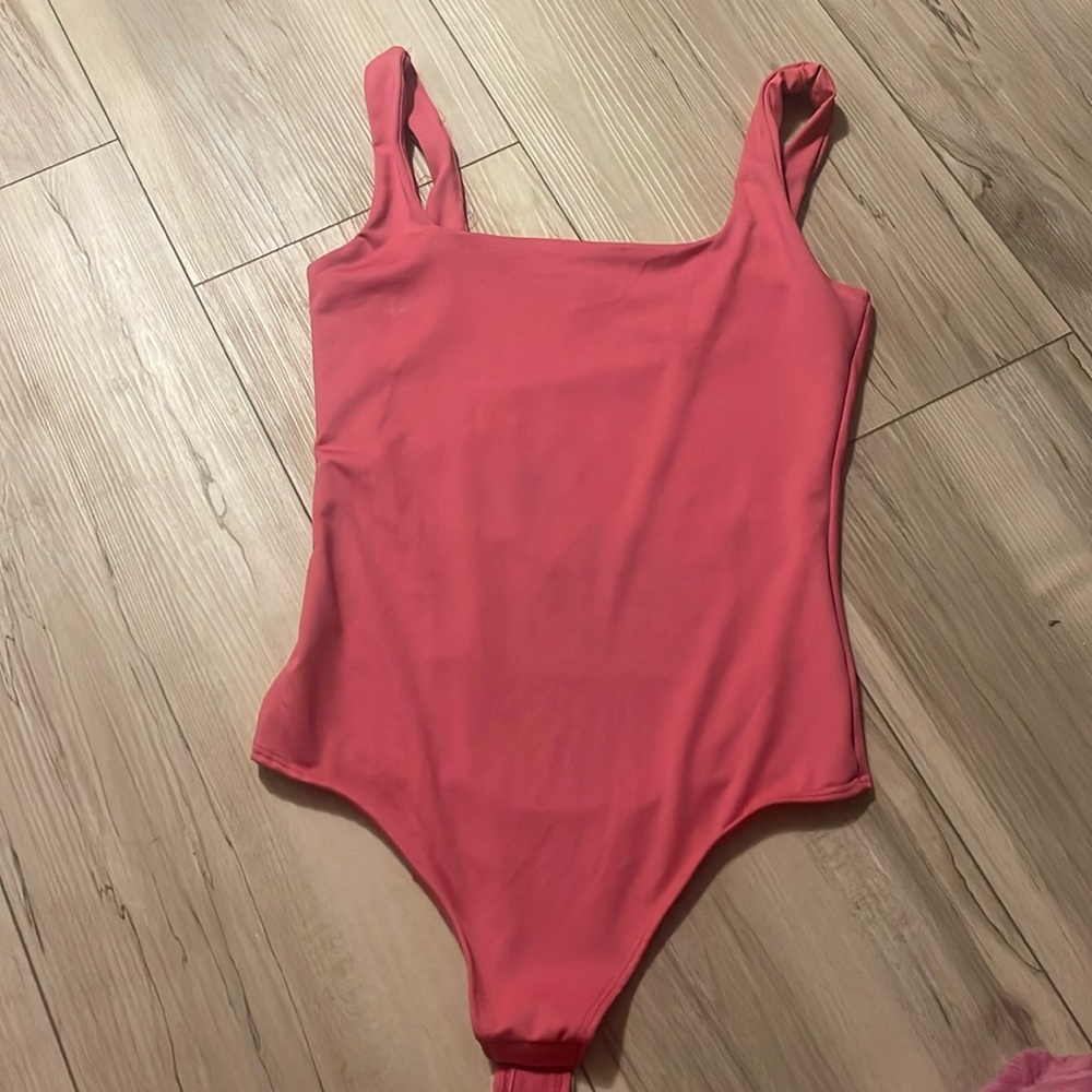 Pink body suit